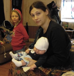 Me holding Galen over his potty bowl during the holidays - he's wearing split pants I made him. Sorry his hat is in his eyes!