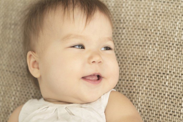 Lovely little girl on burlap