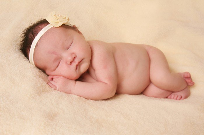 Newborn girl sleeping sweetly