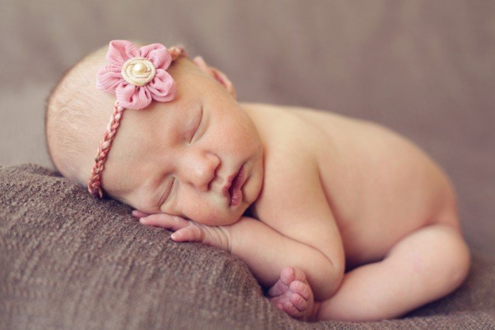 Newborn girl with sweet flower headband