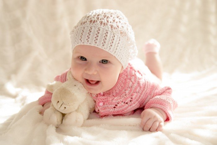 Precious baby girl in a crocheted hat