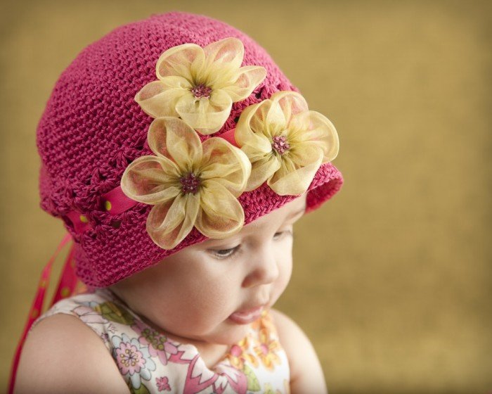Lovely little girl in a classic hat