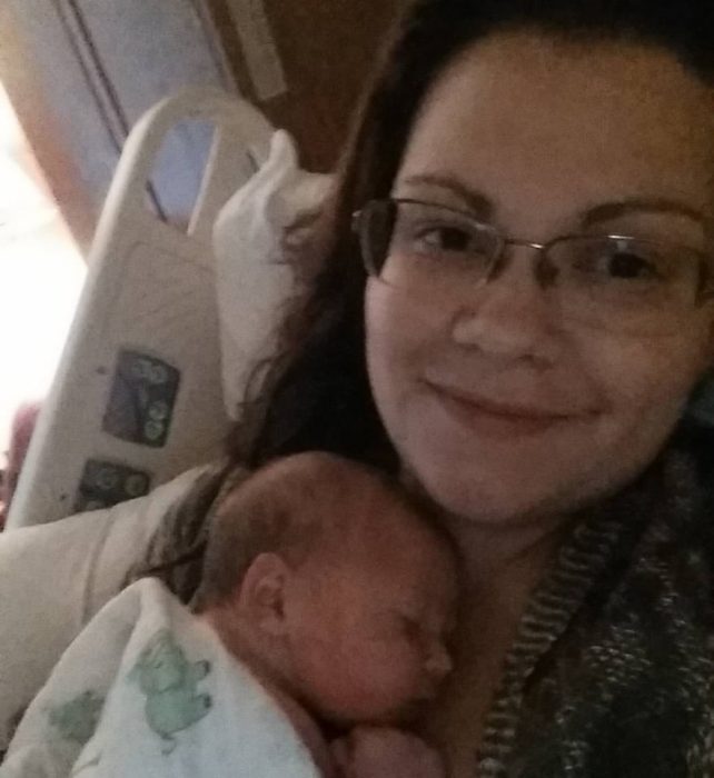 Jude's Birth holding baby
