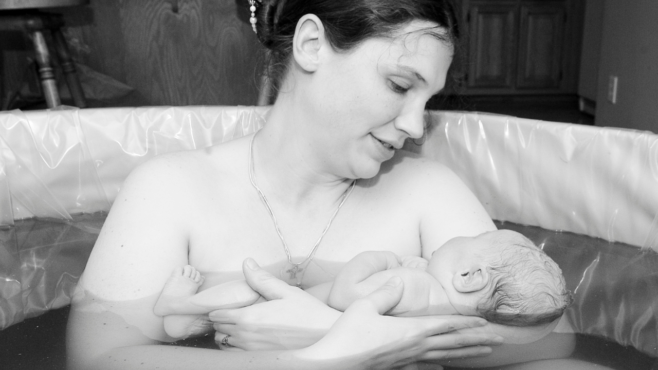 mother holding baby
