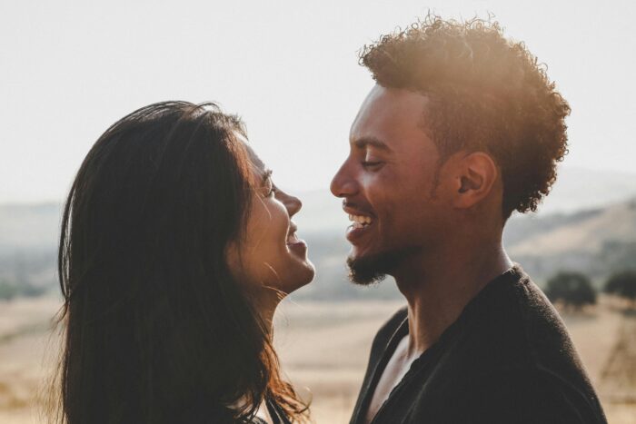 Take Steps for Getting Pregnant couple smile at each other